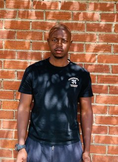 Charlie - Male escort in Nairobi Photo 2 of 3