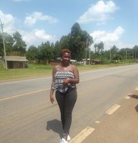 Praxides Alacha - puta in Kisumu